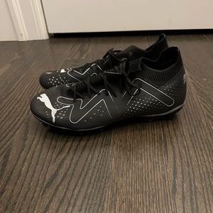 Puma soccer cleats.  Black, size 7 men’s.